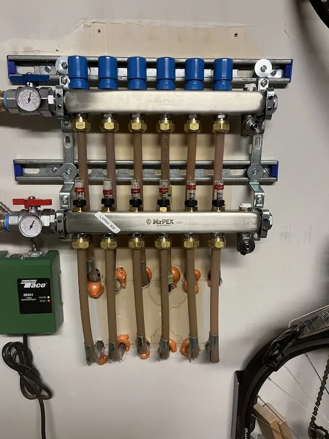 Plumber performing Water Heater Repair at a residential property in Cambridge